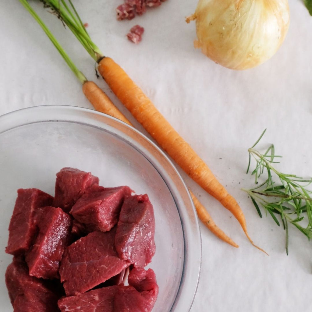 Bison Chuck Roast Chunks with Carrots, Onion and Rosemary.