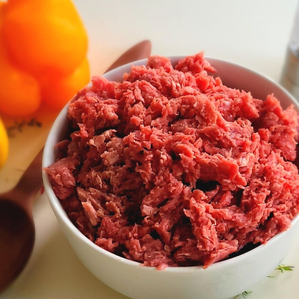 raw ground bison in white bowl.