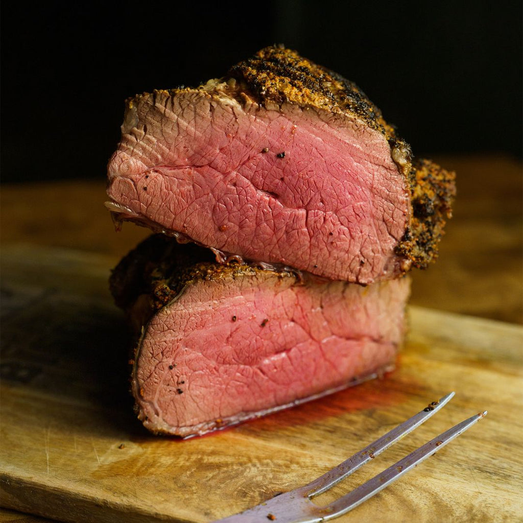 Cooked Bison Tri-Tip cut in half.