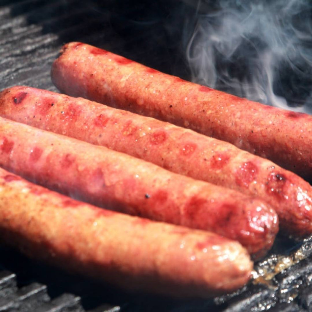 4 Bison Brats on the grill.