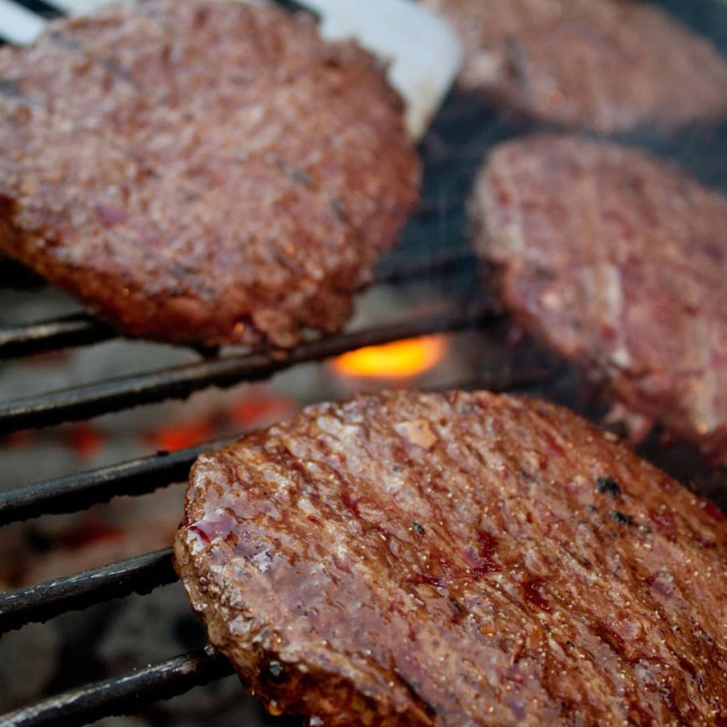 Bison Burger Patties on grill.