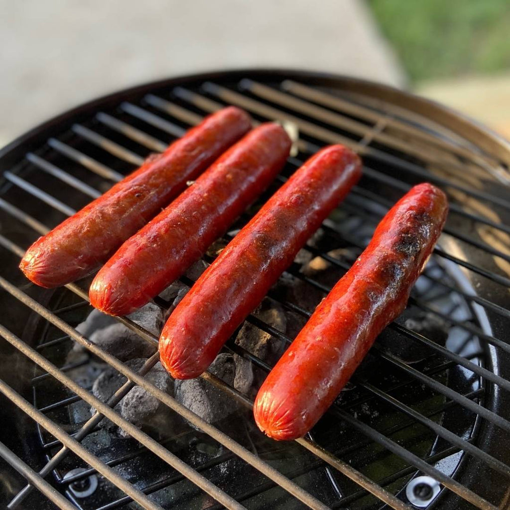 Bison Hot Dogs on grill.