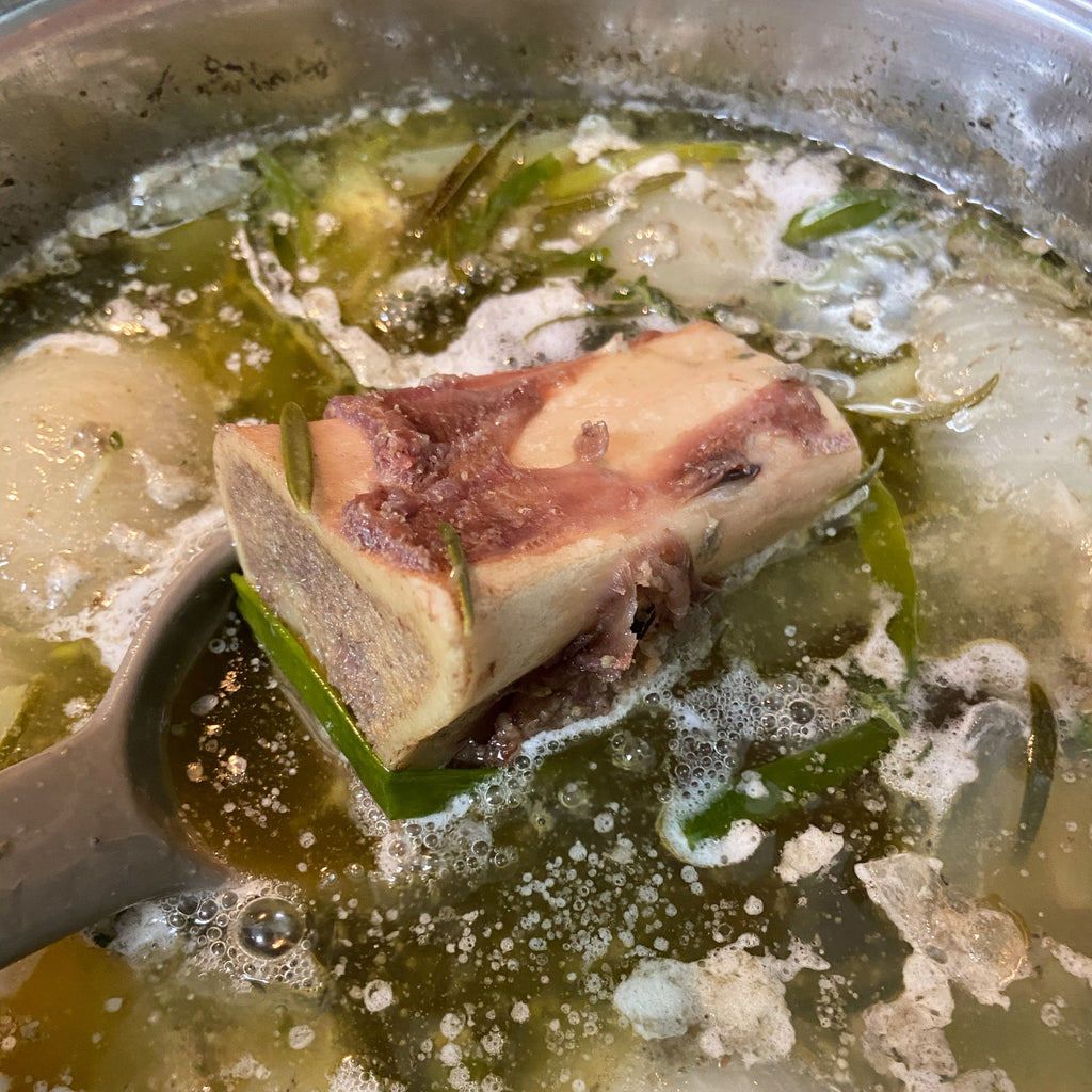 Bison bone cooking in broth.
